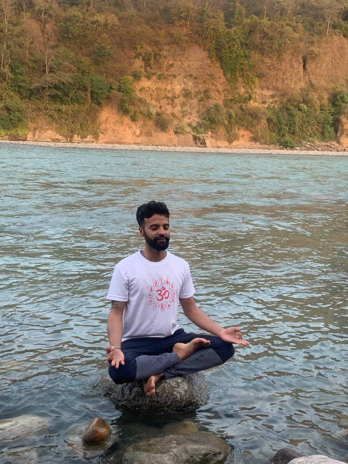 Yoga practitioner in warrior pose outdoors