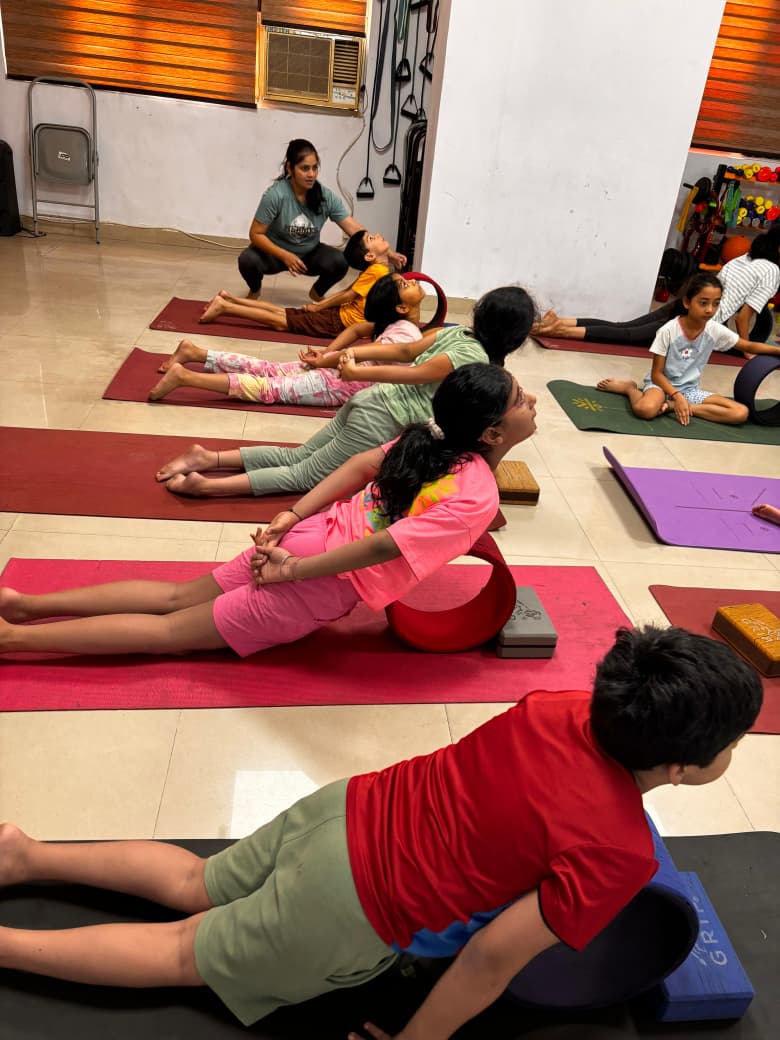 Children practising a balance pose
